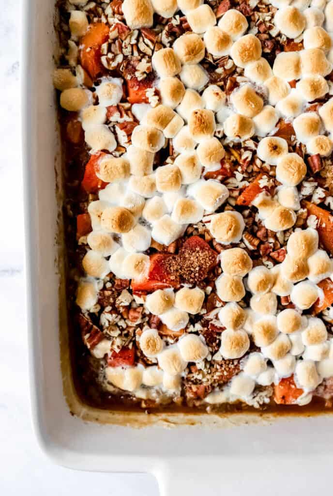 Overhead view of baked sweet potato casserole in white baking dish.