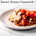 Close up side view of white plate of casserole pin with text overlay.