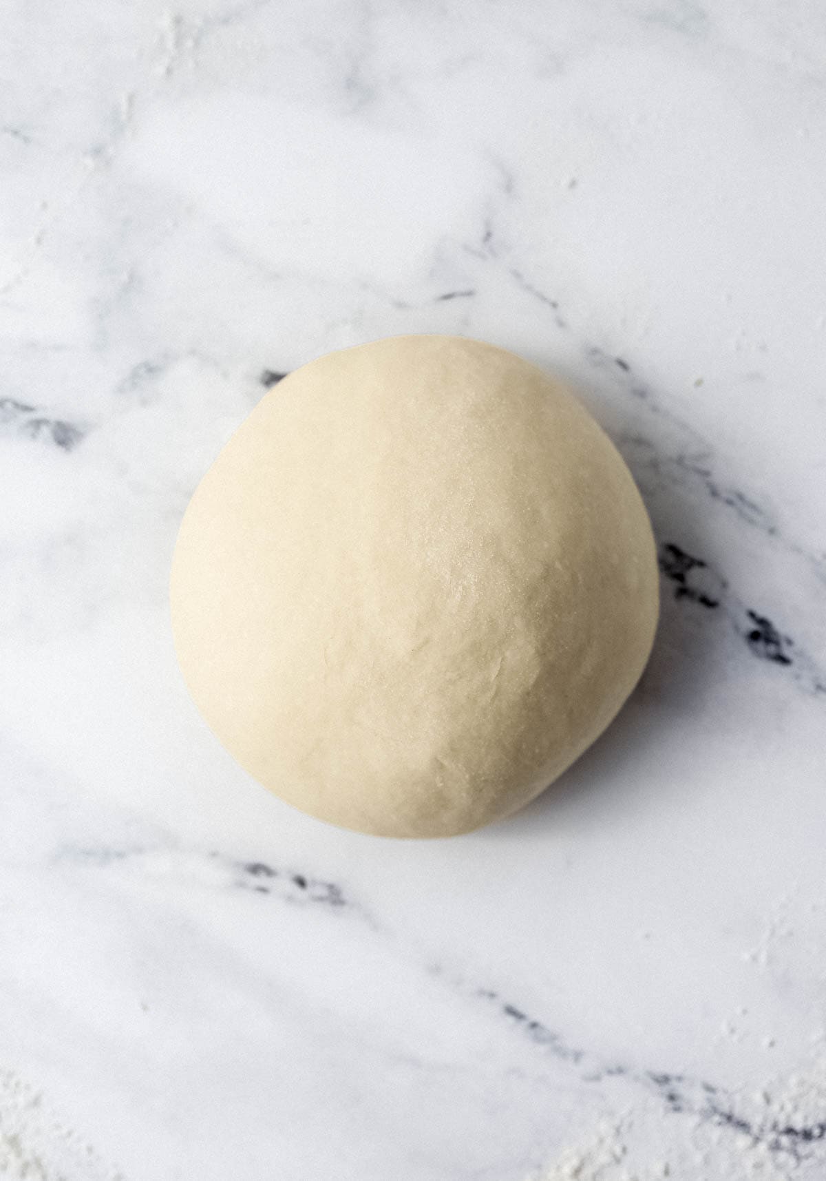 Dough ball on lightly floured surface. 