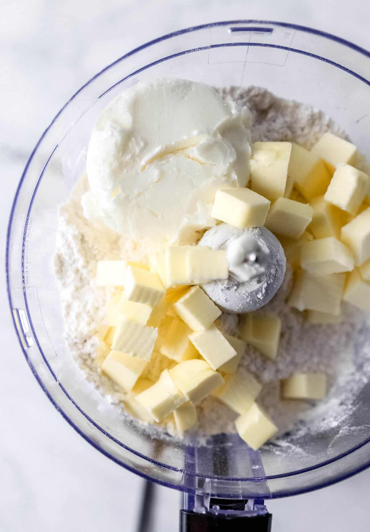 Flour, butter, shotening, and salt added to a food processor. 