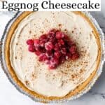 Overhead view of finished cheesecake topped with cranberries pin with text overlay.