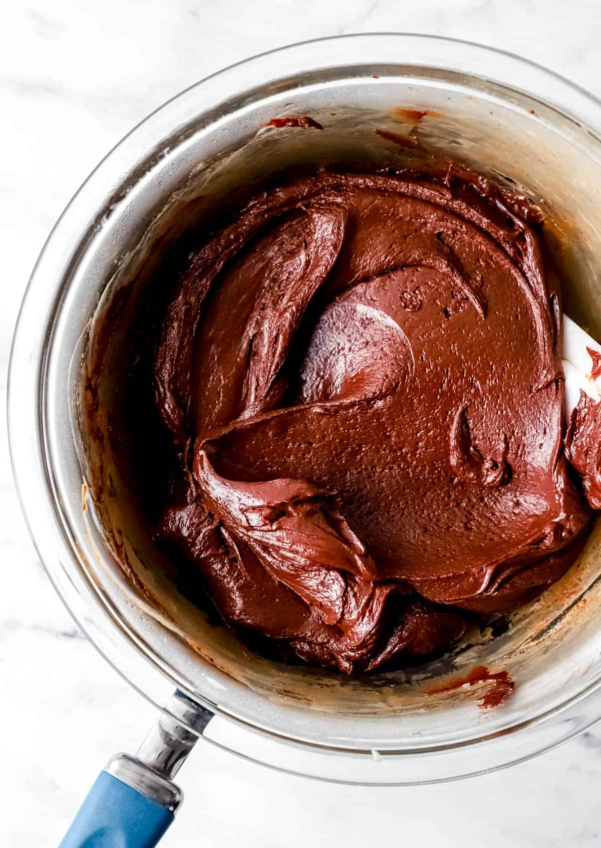 Overhead view of melted fudge ingredients in double boiler. 