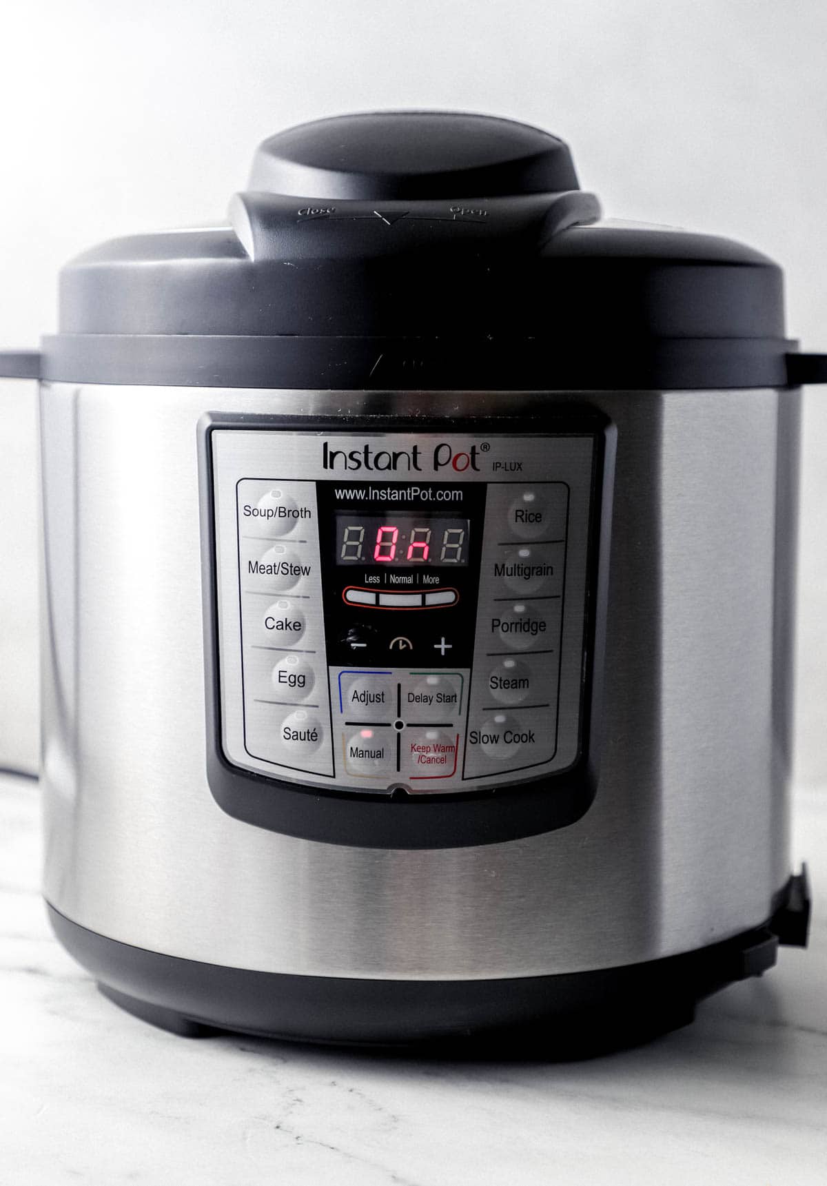 Close up side view of instant pot pressure cooker. 