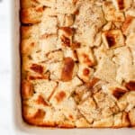 Overhead view of baked french toast in white baking dish.