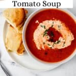 Overhead view of bowl of soup on plate with sandwich pin with text overlay.