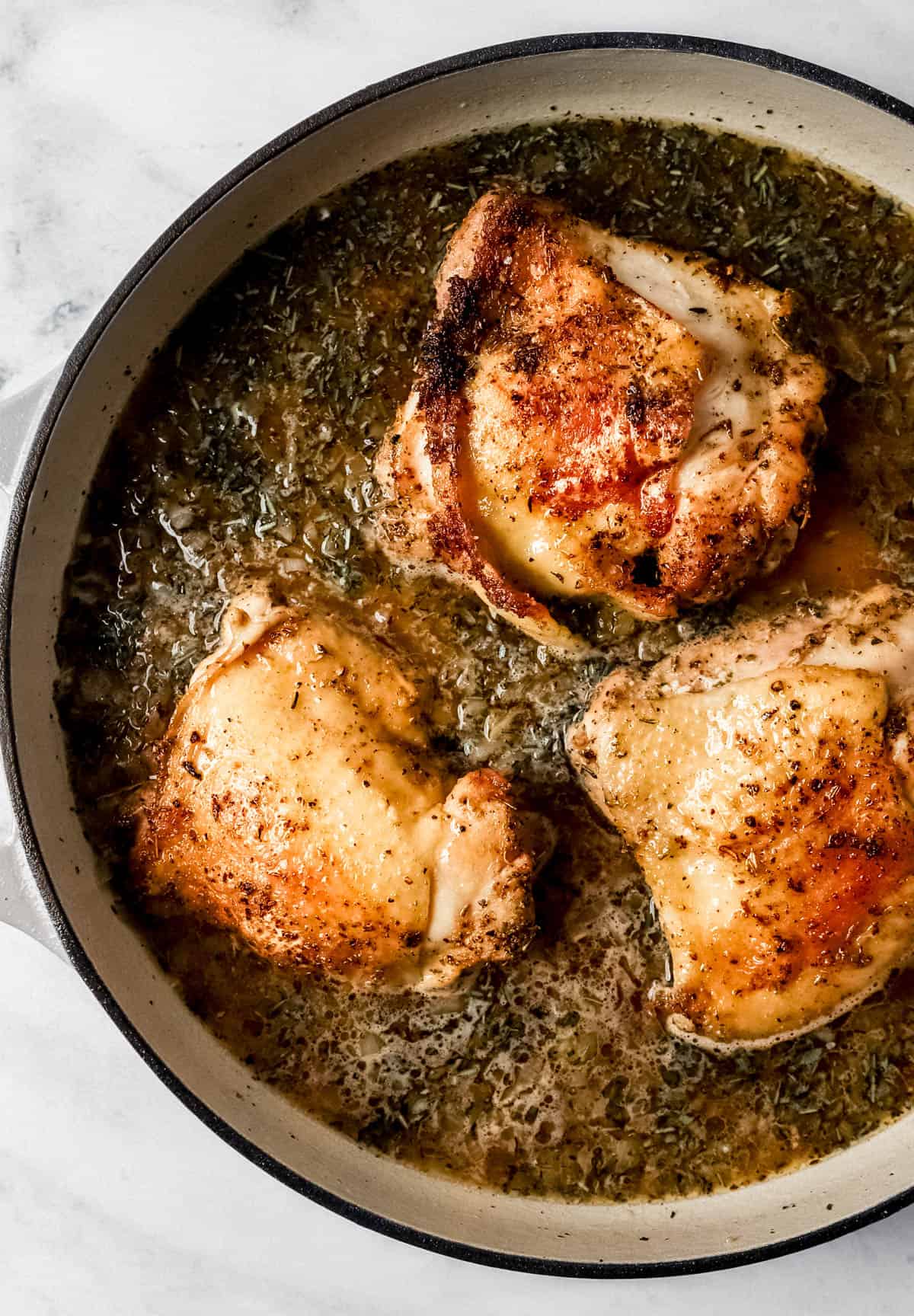 Chicken and rice ingredients in braiser pan before cooking. 