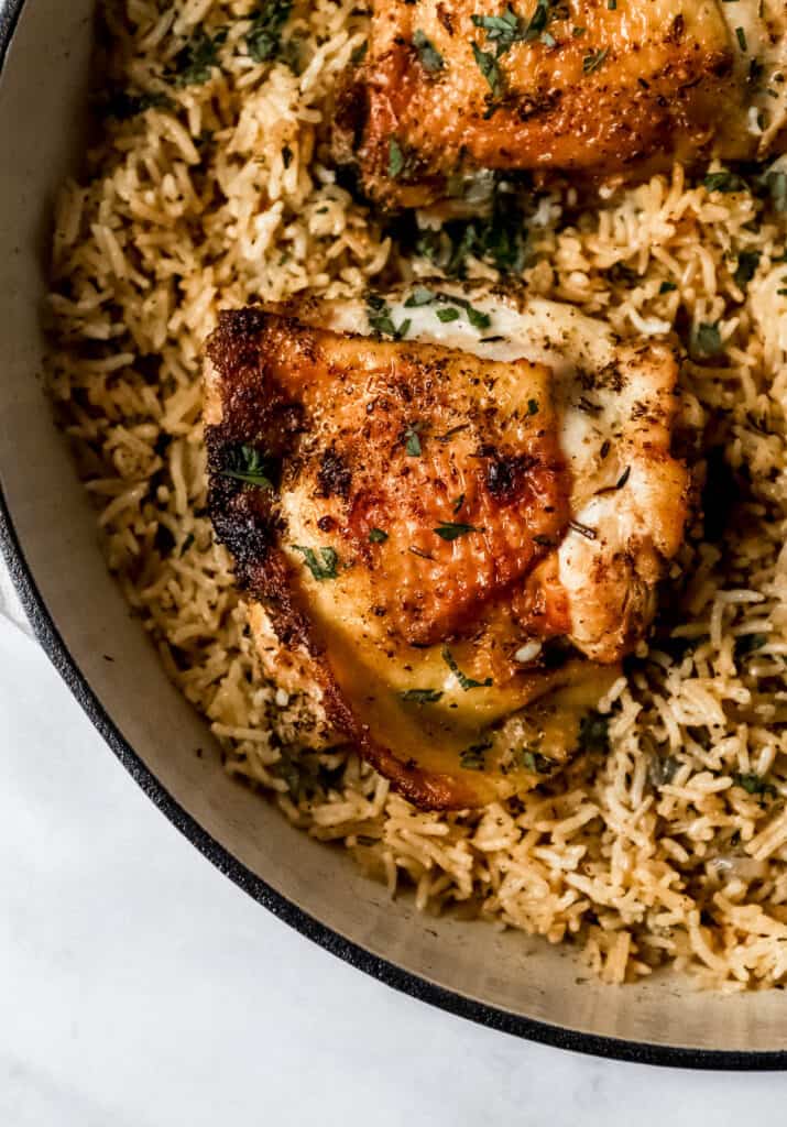 Close up view of finished chicken and rice in pan.