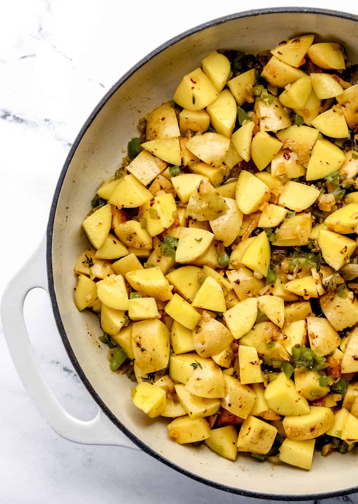 Diced potatoes added to braiser with the other ingredients. 