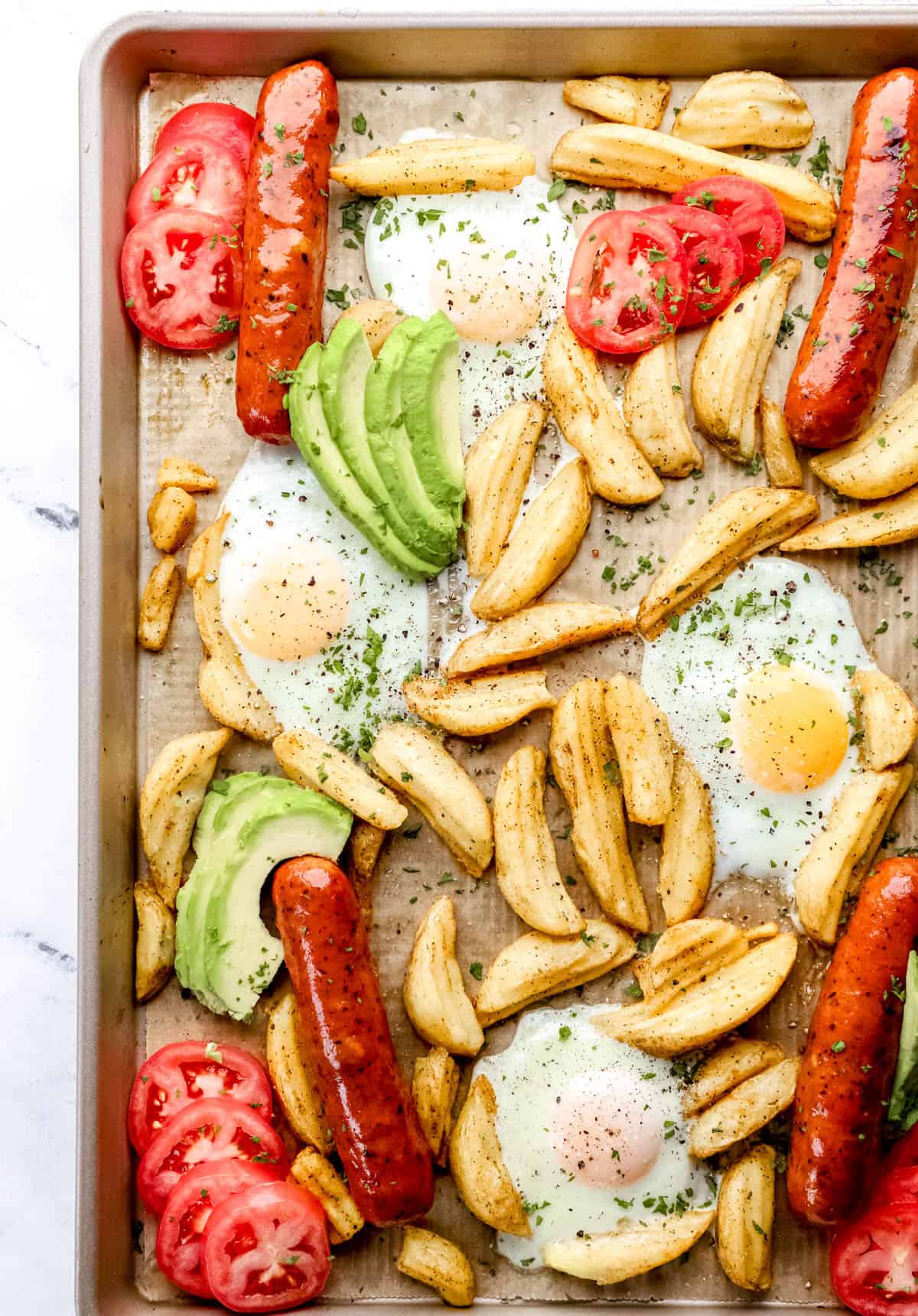 Overhead view of finished breakfast bake on parchment lined baking sheet. 