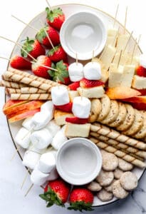 Overhead view of board with white bowls for chocolate.