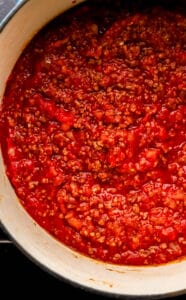 Tomatoes and broth added to the pot with the other soup ingredients.
