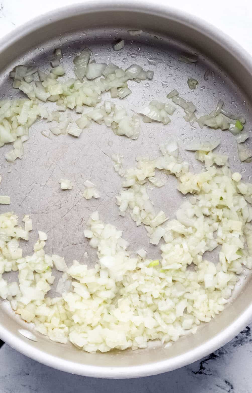 Chopped onion and minced garlic in large skillet with olive oil. 