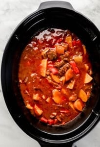 Overhead view of finished beef stew in slow cooker.