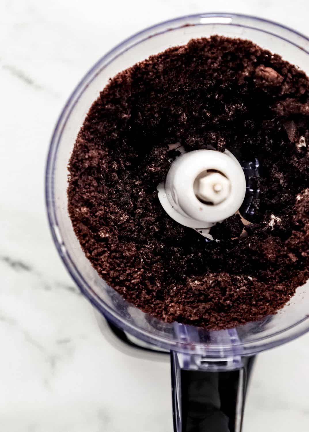 Oreo cookies in food processor after processing. 