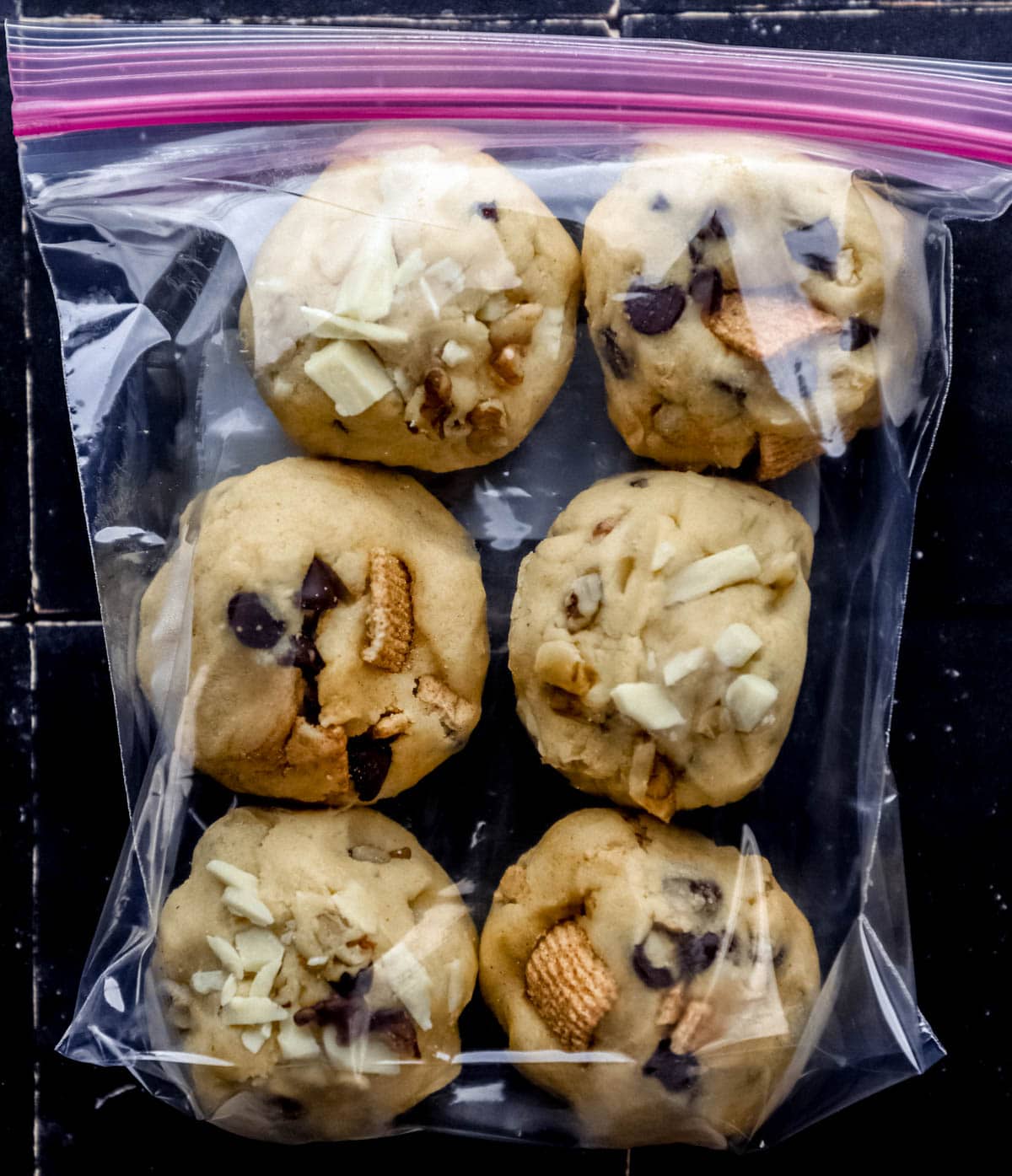 Overhead view of frozen cookie dough in a plastic bag. 