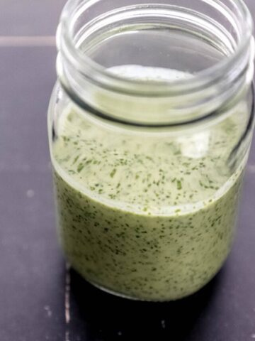 Close up side view of dressing in a jar.