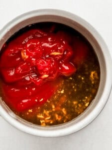 Sauce ingredients added to a mixing bowl.