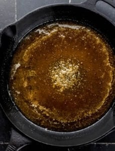 Base of cake caramel ingredients melted in cast iron skillet.