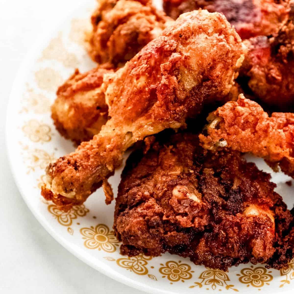 Close up view of fried chicken on a plate. 