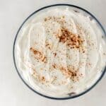 Overhead view of finished pound cake trifle topped with sprinkle of cinnamon.