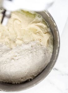 Flour and soda added to the other ingredients in the stand mixer bowl.