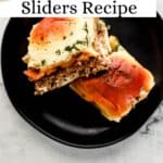 Two finished sliders on black plate on pin with text overlay.
