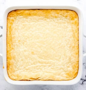 Overhead view of finished squares in white square baking dish.