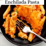 Single serving of pasta on black plate with fork in it on pin with text overlay.