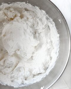Overhead view of heavy cream whipped into stiff peaks.