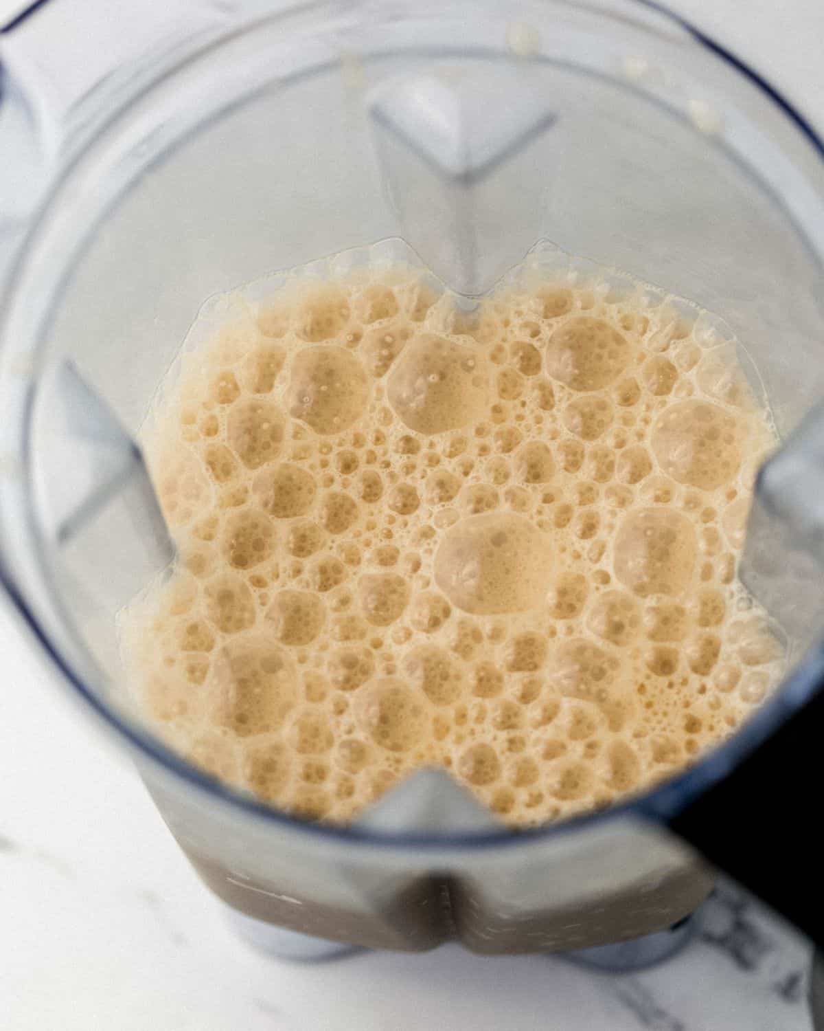 Close up view of drink blended in blender pitcher. 