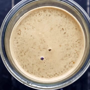 Close up overhead view of finished teriyaki sauce in glass jar.
