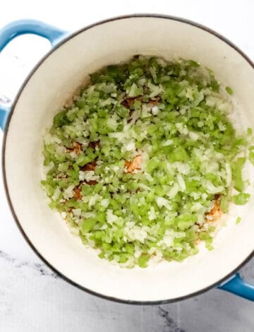 Saute onion, bell pepper, and garlic in large dutch oven.
