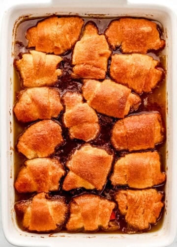 Overhead view of finished sweet potato dumplings in large white baking dish.