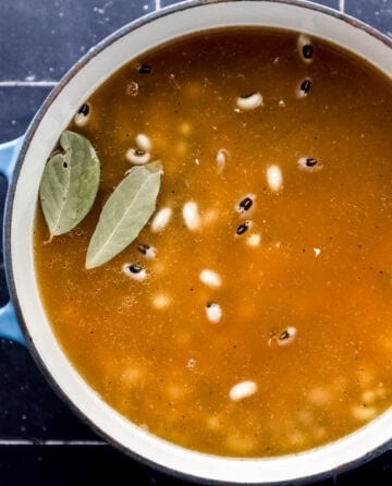 All black eyed pea ingredients added to a dutch oven.