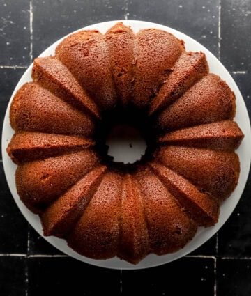 Finished cake inverted on white plate.