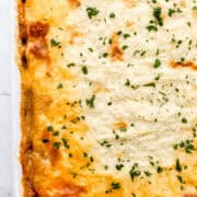Close up view of finished shepherd's pie topped with chopped parsley.