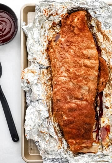 Baked ribs on foil lined sheet pan.