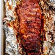 Overhead view of finished ribs on top of foil on sheet pan.