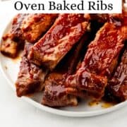 Close up front view of ribs on white plate on pin with text overlay.