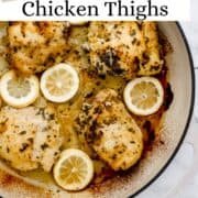 Overhead view of baked chicken in large white braiser pan on pin with text overlay.
