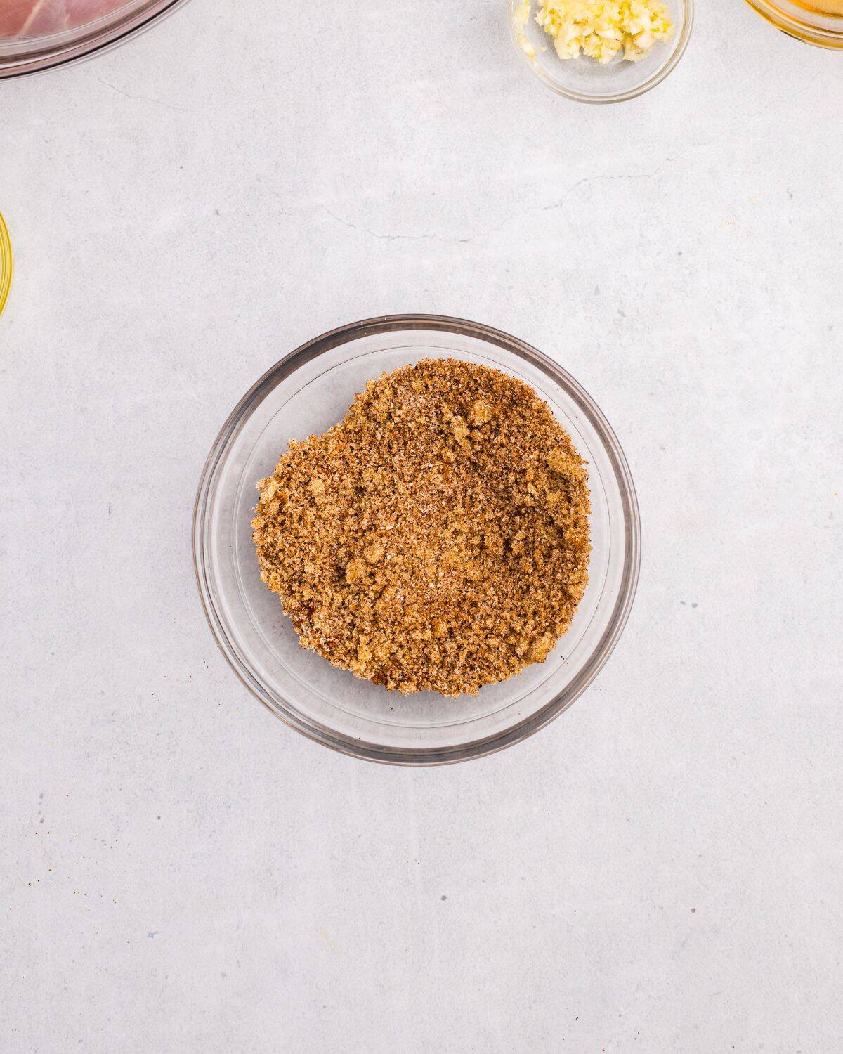 Spice ingredients combined in small glass bowl. 