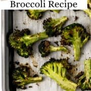 Overhead view of finished broccoli on parchment lined sheet pan on pin with text overlay.