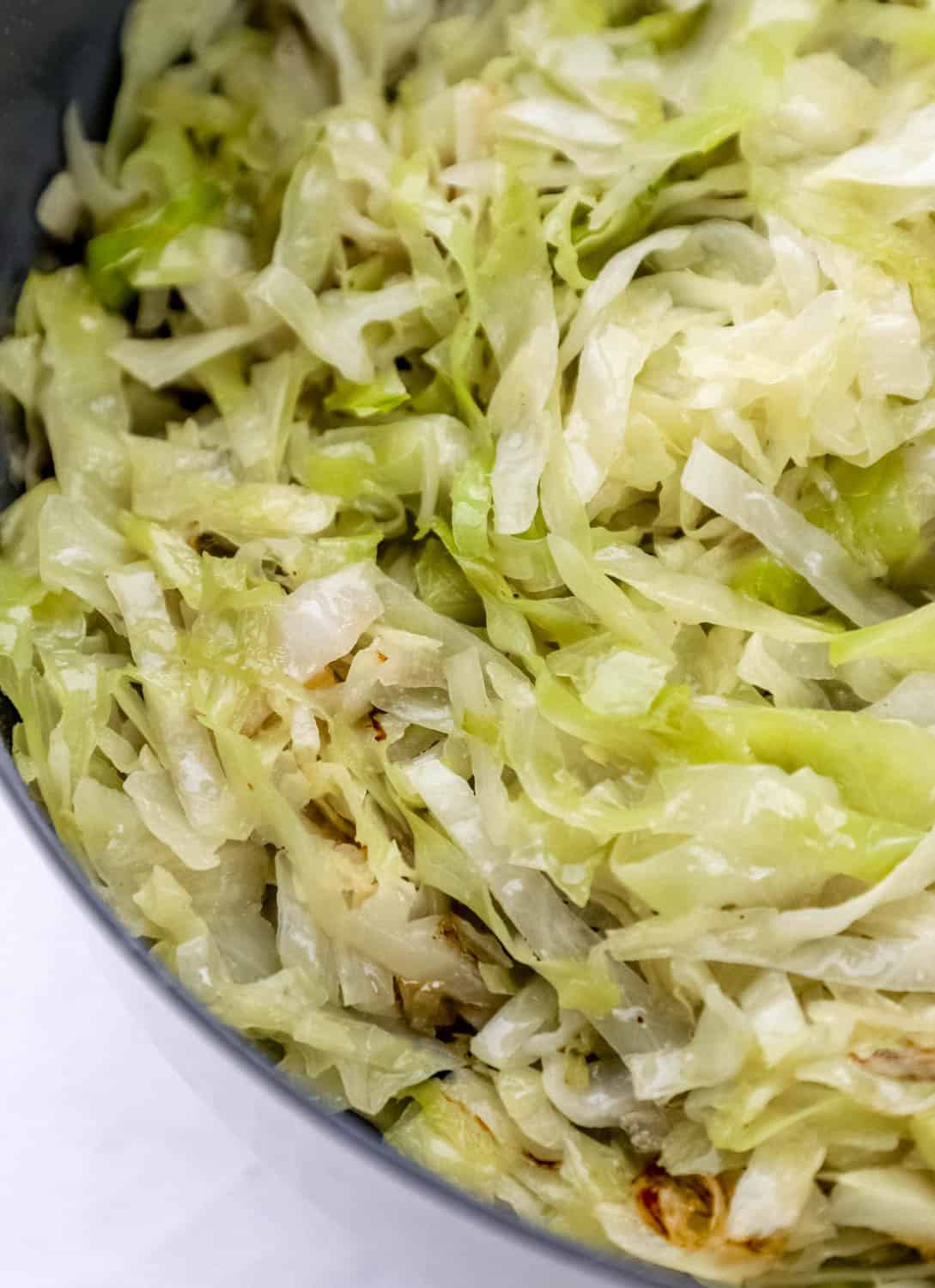 Close up view of finished cabbage in a skillet. 