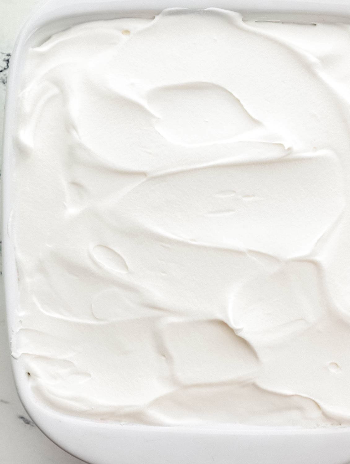 Whipped topping added to the top of the delight. 