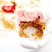 Close up front view of finished dessert in baking dish with some taken out of it.