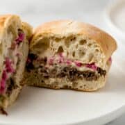 Close up shot of the center of the finished sandwich on white plate.