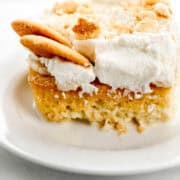 Close up side view of piece of cake on white plate.
