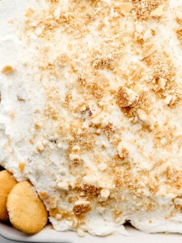 Close up overhead view of finished cake in white baking dish.