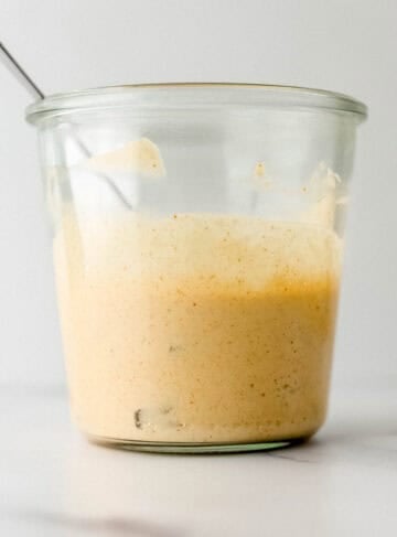Close up side view of jar with finished sauce in it.