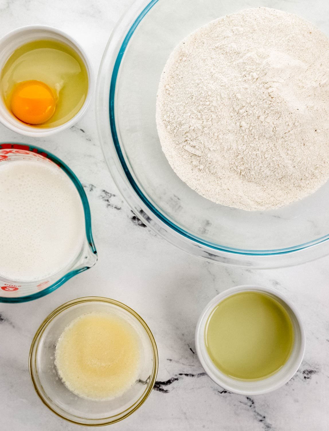 Overhead view of ingredients needed to make recipe in separate bowls. 